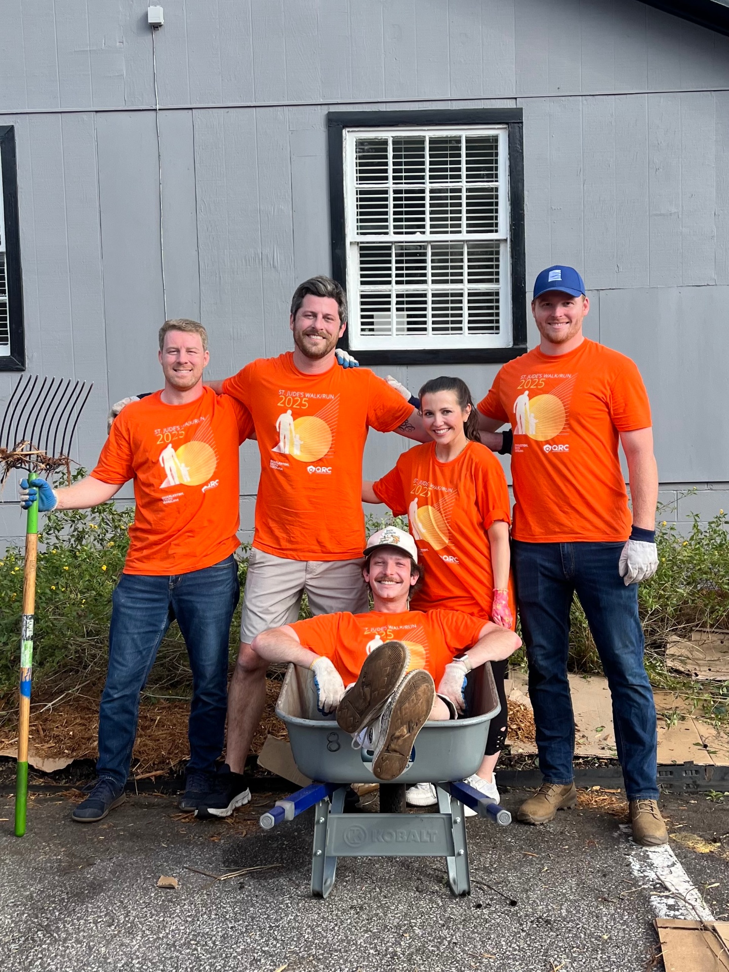 QRC team volunteering at the 2025 St. Jude's Walk/Run in matching orange shirts