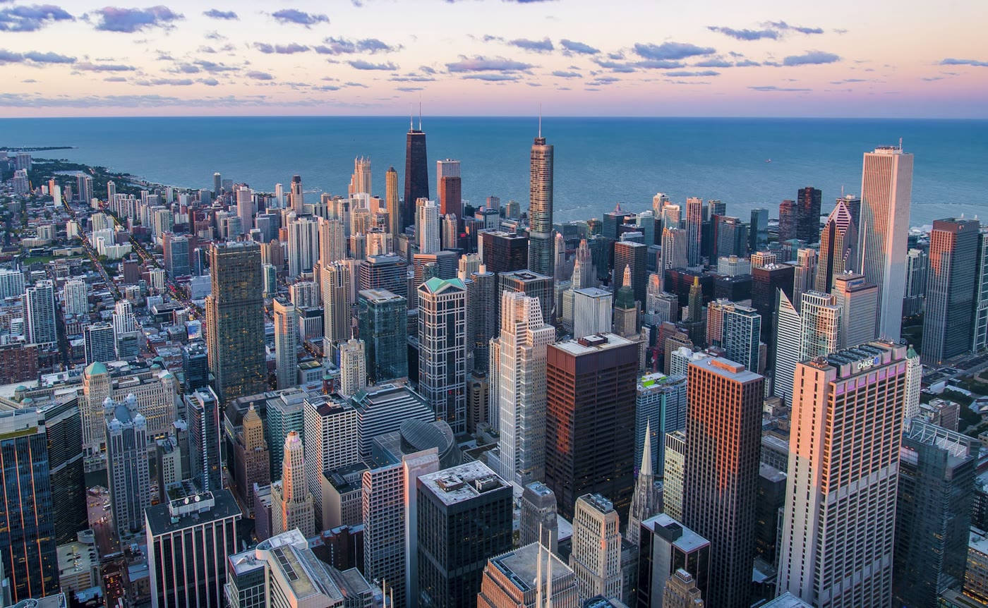 Aerial view of a dense commercial downtown district at dusk