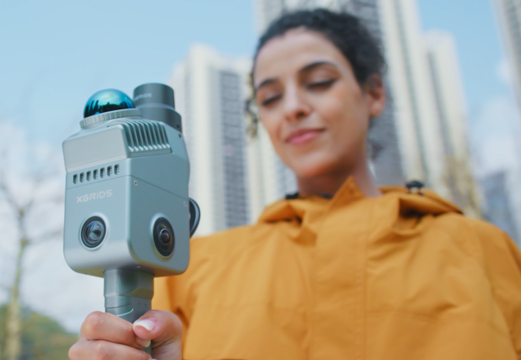 QRC technician operating a handheld mobile LiDAR scanner on an extension pole
